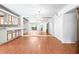 Open-concept living and dining area boasts hardwood floors and an abundance of space and light at 1308 Camelot Dr, Atlanta, GA 30349