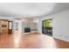 Bright living room features a fireplace, hardwood floors and sliding doors that leads to a patio at 1308 Camelot Dr, Atlanta, GA 30349