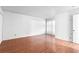 A light-filled living room with wood floors and neutral walls is ready for your personal touch at 1308 Camelot Dr, Atlanta, GA 30349