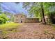 View of backyard and exterior with lush greenery and space for outdoor enjoyment at 2233 Cherokee Valley Dr, Lithonia, GA 30058