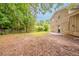 Spacious backyard featuring a lush treeline and ample room for outdoor activities and landscaping at 2233 Cherokee Valley Dr, Lithonia, GA 30058