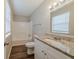 Bathroom featuring granite countertops, modern sink, and bathtub with shower at 2233 Cherokee Valley Dr, Lithonia, GA 30058