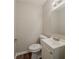 Powder room with modern vanity, mirror, and new toilet at 2233 Cherokee Valley Dr, Lithonia, GA 30058