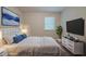 Well-decorated bedroom with a large bed, modern furniture, and stylish decor at 2233 Cherokee Valley Dr, Lithonia, GA 30058