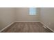 Empty bedroom featuring carpet flooring, neutral paint, and natural light from a window at 2233 Cherokee Valley Dr, Lithonia, GA 30058