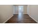 Bright hallway with beautiful wood-look flooring leading to other rooms of the home at 2233 Cherokee Valley Dr, Lithonia, GA 30058