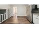 Open concept kitchen features granite counters, stainless steel appliances and flows into other rooms at 2233 Cherokee Valley Dr, Lithonia, GA 30058
