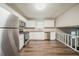 Bright eat-in kitchen features stainless steel appliances, granite counters, white cabinets and vinyl floors at 2233 Cherokee Valley Dr, Lithonia, GA 30058