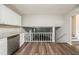 Bright eat-in kitchen features stainless steel appliances, granite counters, white cabinets and vinyl floors at 2233 Cherokee Valley Dr, Lithonia, GA 30058