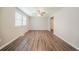Spacious living room offers natural light, vinyl floors and an open concept with a ceiling fan at 2233 Cherokee Valley Dr, Lithonia, GA 30058