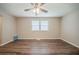Large living room provides natural light, vinyl floors and an open concept with ceiling fan at 2233 Cherokee Valley Dr, Lithonia, GA 30058