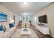 Inviting living room with ample seating, plush rug, and staircase access to the upper level at 2233 Cherokee Valley Dr, Lithonia, GA 30058