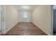 Room featuring vinyl floors, neutral paint, and natural light from a window at 2233 Cherokee Valley Dr, Lithonia, GA 30058