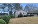 Charming home with brick accents and neat landscaping on a bright day at 3873 Jane Marie Ln, Decatur, GA 30035
