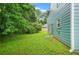 The expansive backyard with the home's exterior in view at 4753 Klondike Cv, Lithonia, GA 30038