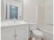 Bright bathroom with white vanity, granite countertop, framed mirror and tub and shower combo at 4753 Klondike Cv, Lithonia, GA 30038