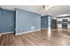 Open living room featuring hard floors, ceiling fan, and stairway access at 4753 Klondike Cv, Lithonia, GA 30038