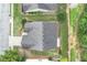 Birds eye view of a home featuring a well-maintained roof, green lawn, and lovely landscape design, adding to its curb appeal at 936 Village View Cir, Loganville, GA 30052