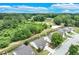 A bird's-eye view of a residential area, displaying the layout and surroundings of the neighborhood, and streetscape at 936 Village View Cir, Loganville, GA 30052
