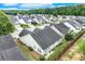Aerial view of a single-Gathering home showcasing well-maintained landscaping, a fenced yard, and a neatly manicured neighborhood at 936 Village View Cir, Loganville, GA 30052