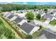 An aerial view of a residential area, showcasing the layout and design of the homes and neighborhood, surrounded by lush trees at 936 Village View Cir, Loganville, GA 30052