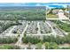 A community aerial view showing homes with beautiful landscapes, mature trees, and well-maintained lawns and common areas at 936 Village View Cir, Loganville, GA 30052