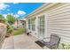 Relaxing backyard with a patio and a well-maintained lawn, complemented by a garden, adding charm to the outdoor living space at 936 Village View Cir, Loganville, GA 30052