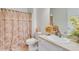 Bathroom featuring a decorative shower curtain, neutral walls, and tile floors at 936 Village View Cir, Loganville, GA 30052