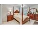 Bedroom with traditional wood furniture, neutral walls, and soft carpet at 936 Village View Cir, Loganville, GA 30052
