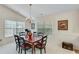 Bright dining room featuring large windows, neutral walls, and a chandelier at 936 Village View Cir, Loganville, GA 30052