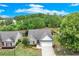 Charming single-story home with a well-manicured lawn, attached garage, and beautiful landscaping at 936 Village View Cir, Loganville, GA 30052