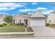 Inviting single-Gathering home with a brick and siding exterior, neat landscaping, and a two-car garage at 936 Village View Cir, Loganville, GA 30052