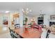 Open concept living room and dining area featuring hardwood floors and a decorative chandelier at 936 Village View Cir, Loganville, GA 30052