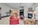 Spacious living room featuring a fireplace, ceiling fan, and plenty of natural light at 936 Village View Cir, Loganville, GA 30052