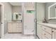 Bright bathroom with double vanity, illuminated mirrors, and glass shower at 2676 Varner Ne Dr, Atlanta, GA 30345