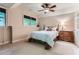 Comfortable bedroom featuring neutral walls, plush carpet, ceiling fan, and traditional-style furniture at 2676 Varner Ne Dr, Atlanta, GA 30345