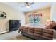Comfortable bedroom featuring neutral walls, plush carpet, ceiling fan, and a large window at 2676 Varner Ne Dr, Atlanta, GA 30345