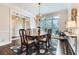 Formal dining room featuring hardwood floors, chandelier lighting, and large windows creating an inviting space for gatherings at 2676 Varner Ne Dr, Atlanta, GA 30345