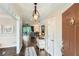 Elegant foyer with hardwood floors, decorative lighting, and views into the living room offering a bright and airy feel at 2676 Varner Ne Dr, Atlanta, GA 30345