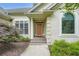 Inviting front entrance with a decorative door, arched window, and manicured landscaping, creating a welcoming ambiance at 2676 Varner Ne Dr, Atlanta, GA 30345