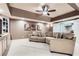 Spacious living room with plush sofa, neutral walls, tray ceiling, and recessed lighting at 2676 Varner Ne Dr, Atlanta, GA 30345