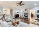 Spacious living room with hardwood floors, ceiling fan, fireplace, and stylish furnishings, perfect for relaxation and entertaining at 2676 Varner Ne Dr, Atlanta, GA 30345
