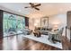 Bright living room features hardwood floors, neutral decor, ceiling fan and sliding glass doors to the outdoor living area at 2676 Varner Ne Dr, Atlanta, GA 30345