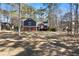 Charming two-story home with blue and red siding, an American flag, and a spacious front yard at 4970 Lost Mountain Nw Trce, Kennesaw, GA 30152