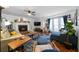 Inviting living room featuring hardwood floors, a fireplace, and ample natural light at 4970 Lost Mountain Nw Trce, Kennesaw, GA 30152