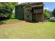 This home features a large, grassy backyard, patio, and elevated, screened-in porch at 5418 Amity Dr, Powder Springs, GA 30127