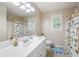 Bright bathroom with a shower, vanity, toilet, and fun jungle-themed decorations at 5418 Amity Dr, Powder Springs, GA 30127