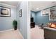 Cozy bonus room with built-in shelves, comfortable seating, and stylish decor at 5418 Amity Dr, Powder Springs, GA 30127