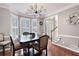 Elegant dining room featuring hardwood floors, a modern chandelier, and neutral paint at 5418 Amity Dr, Powder Springs, GA 30127