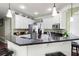 This kitchen features granite counters, stainless appliances, and bright white cabinetry with decorative moldings at 5418 Amity Dr, Powder Springs, GA 30127